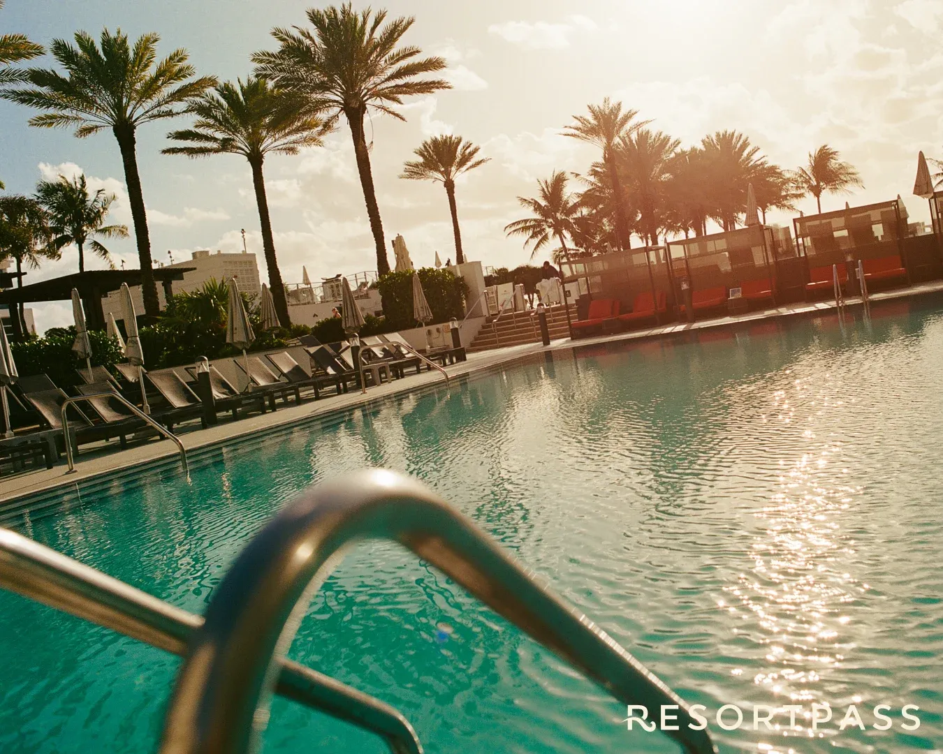 A hotel pool at sunset for the ResortPass DMV launch